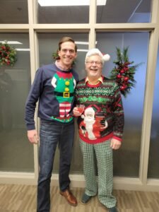 Brian Halverson and Gary Hanson in their festive Christmas Sweaters